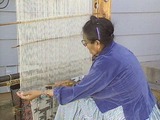 A Peoples' History of Utah: Cultural Life in the Twentieth Century. Navajo Indian woman weaving wool rugs.