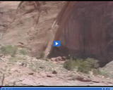 Geography of Utah. Utah Landforms Part 1. Rainbow Bridge with tourists in foreground.