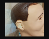 Simulated Hearing Aid Placed Inside a Mannequin Ear